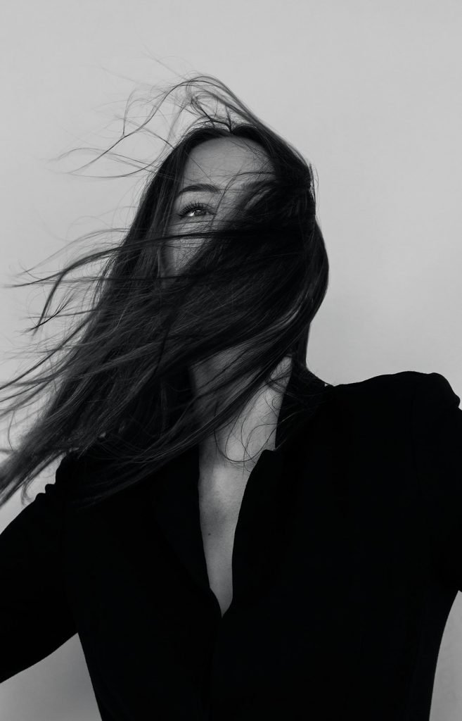 grayscale-photography-of-woman-wearing-long-sleeved-shirt-uqt55tgbqzi Windy day